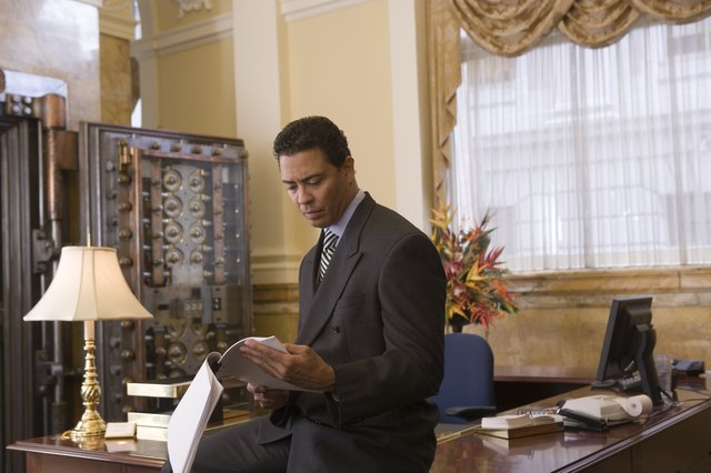 Banker reviewing paperwork