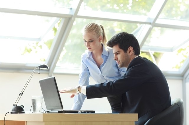 Business Team Working On Laptop