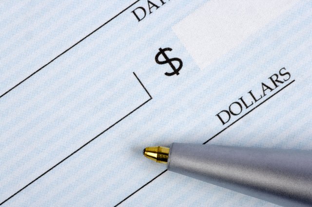 Closeup of check with pen
