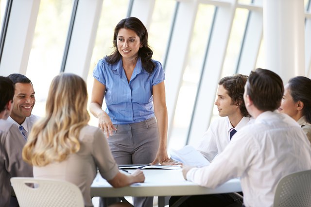 Business People Having Board Meeting In Office