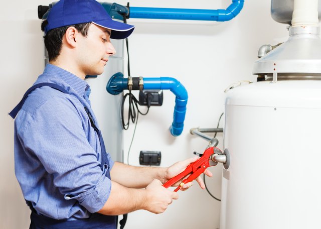 Technician repairing an hot-water heater