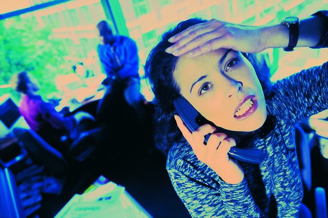 Stressed out woman in business office