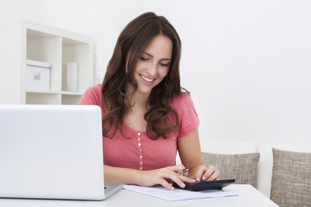 Happy Woman Calculating Bills