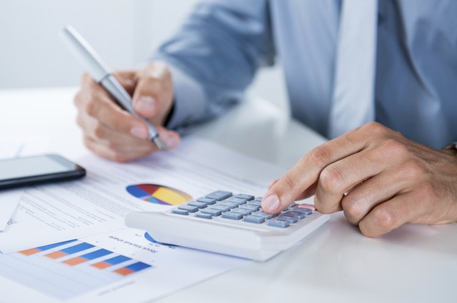 Businessman Doing Calculations