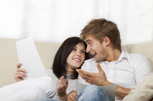 Couple sitting on couch at home
