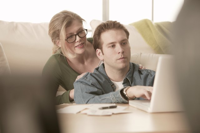 Couple paying bills online