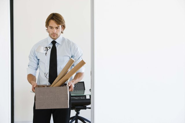 Businessman with box of supplies
