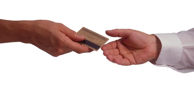 Hands with credit card
