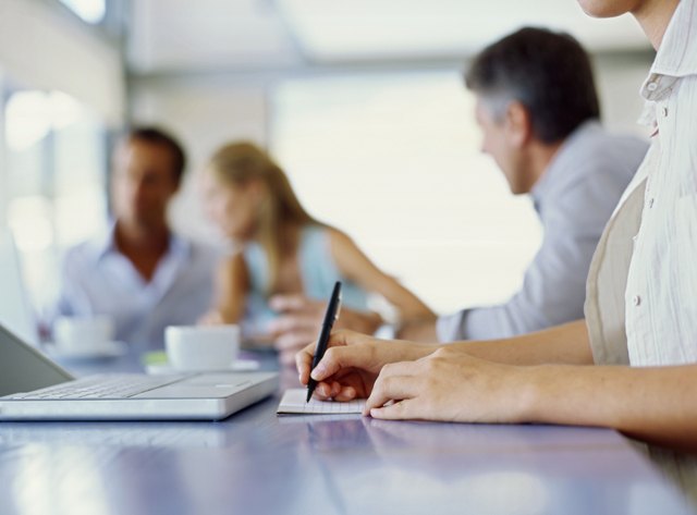 business executives discussing work in an office