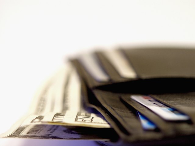 Close-up of a wallet with American bank notes and credit cards