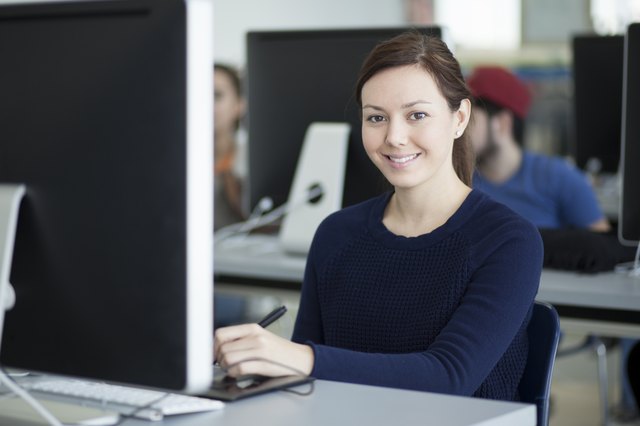 Happy female designer at work