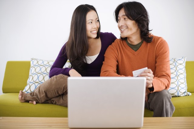 Smiling couple shopping online