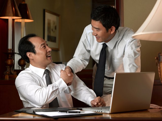 Businessmen shaking hands.