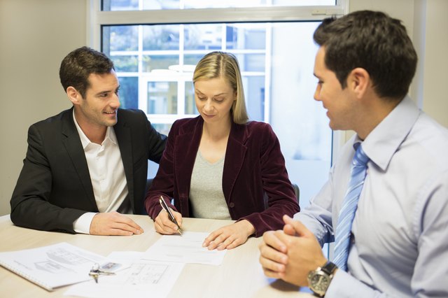 Couple signing real-estate contract