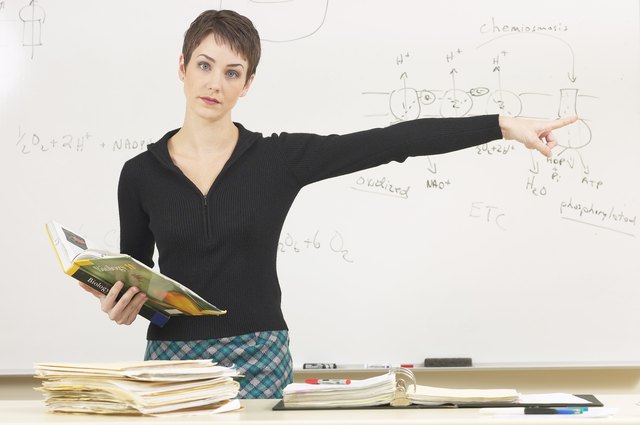 Science teacher pointing away